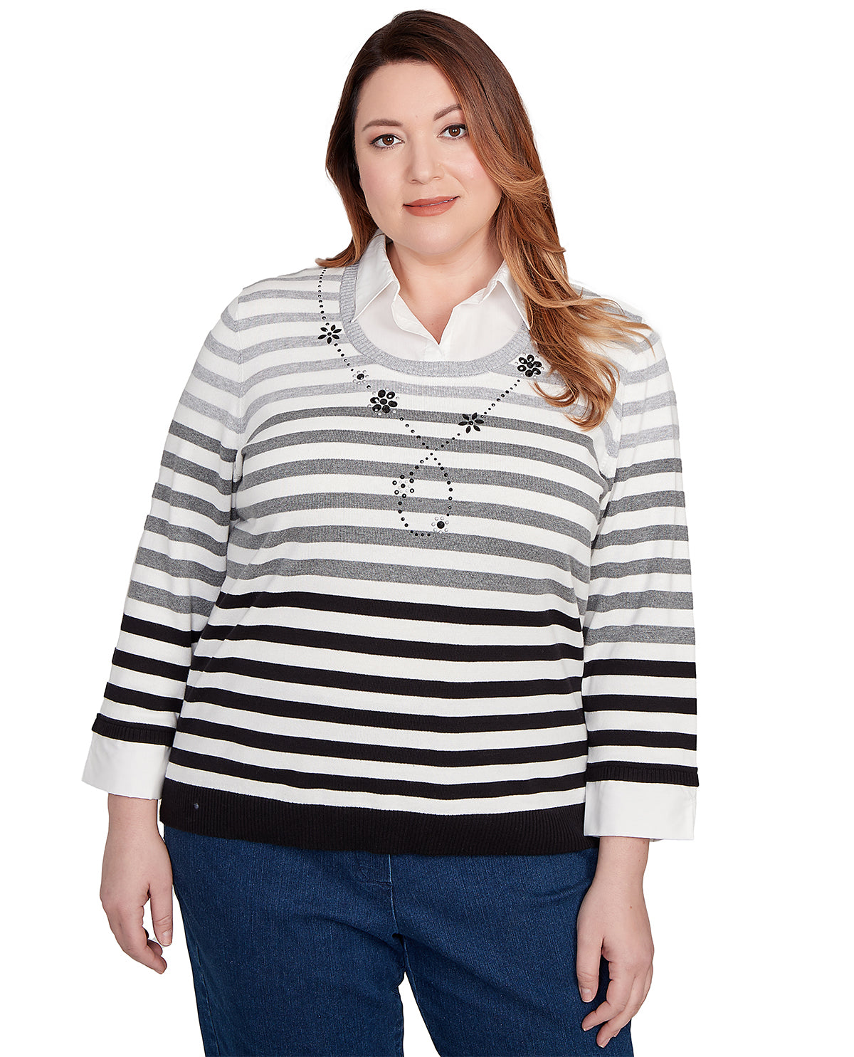 Woman wearing a black and white striped sweater on a white background