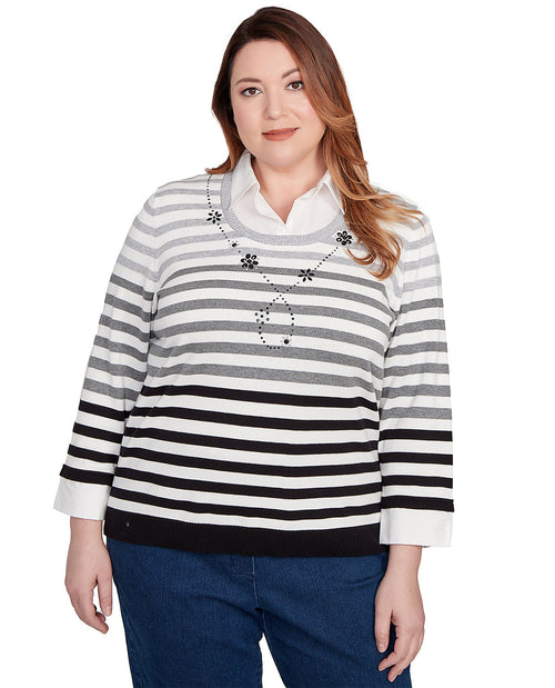 Woman wearing a black and white striped sweater on a white background