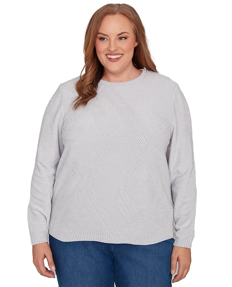 Woman wearing a light gray sweater on a white background