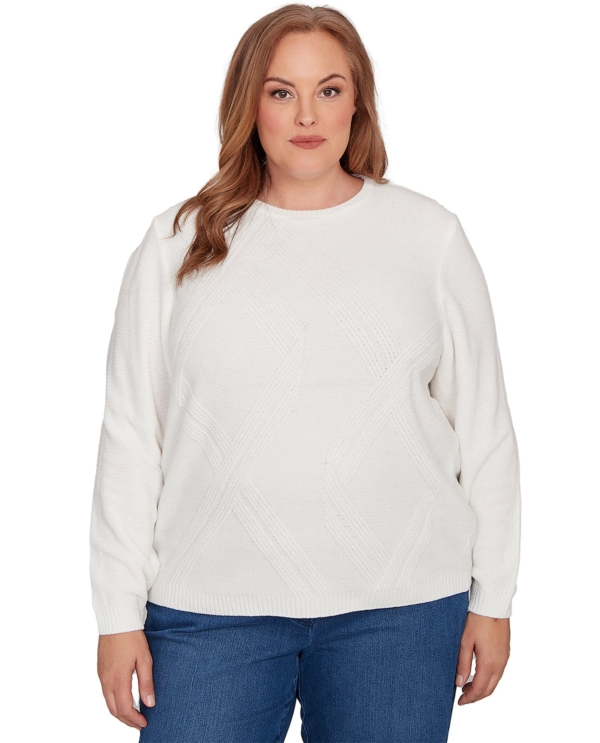 A woman modeling a white long-sleeve knit sweater with a textured diamond pattern on the front, paired with blue jeans, against a plain white background.