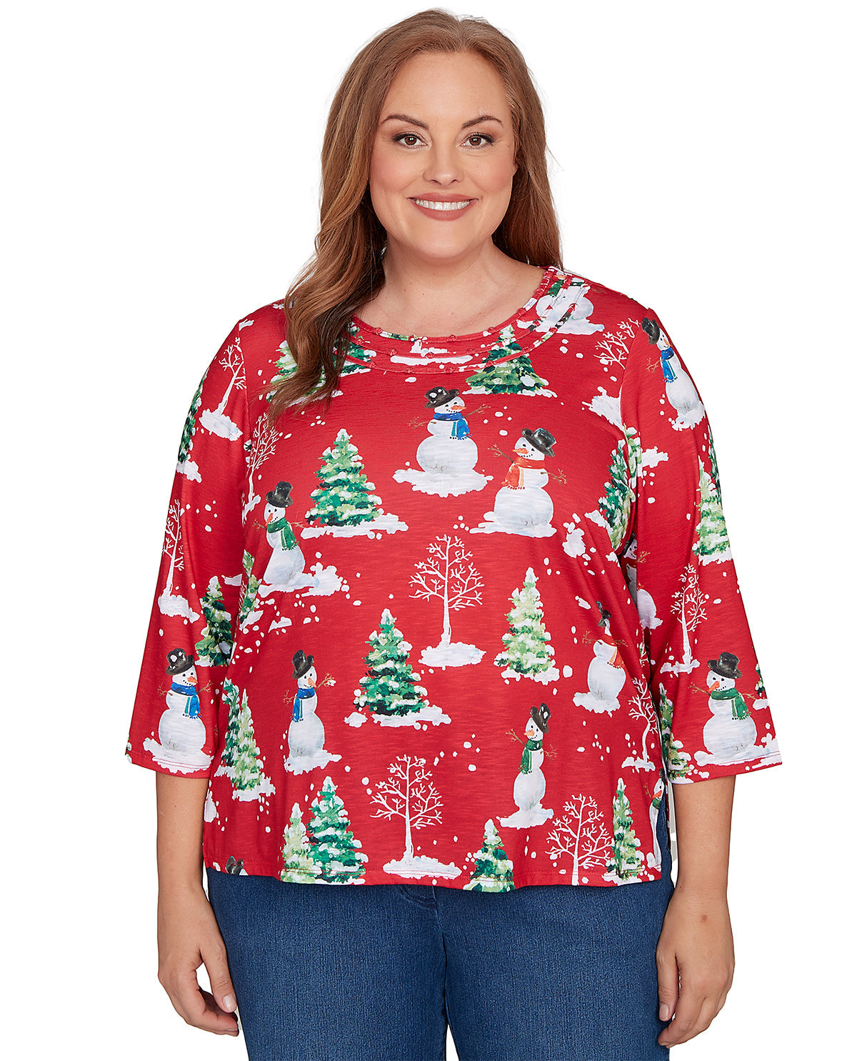 Woman wearing a red Christmas-themed blouse with snowmen and trees on a white background