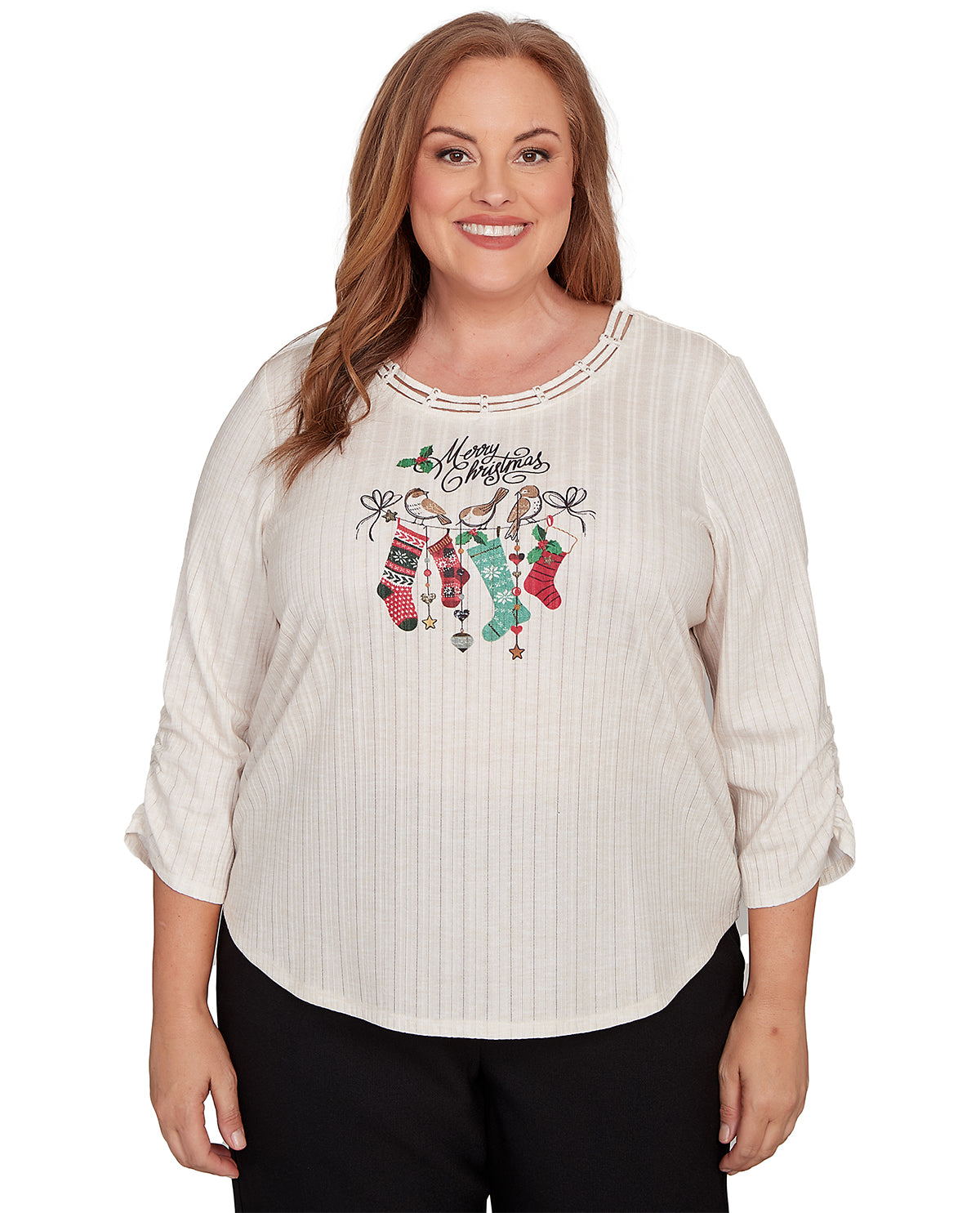 Woman wearing a white blouse with Christmas-themed design on a white background