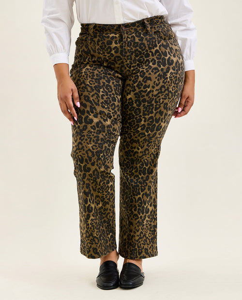 Leopard print pants worn by a person on a plain background
