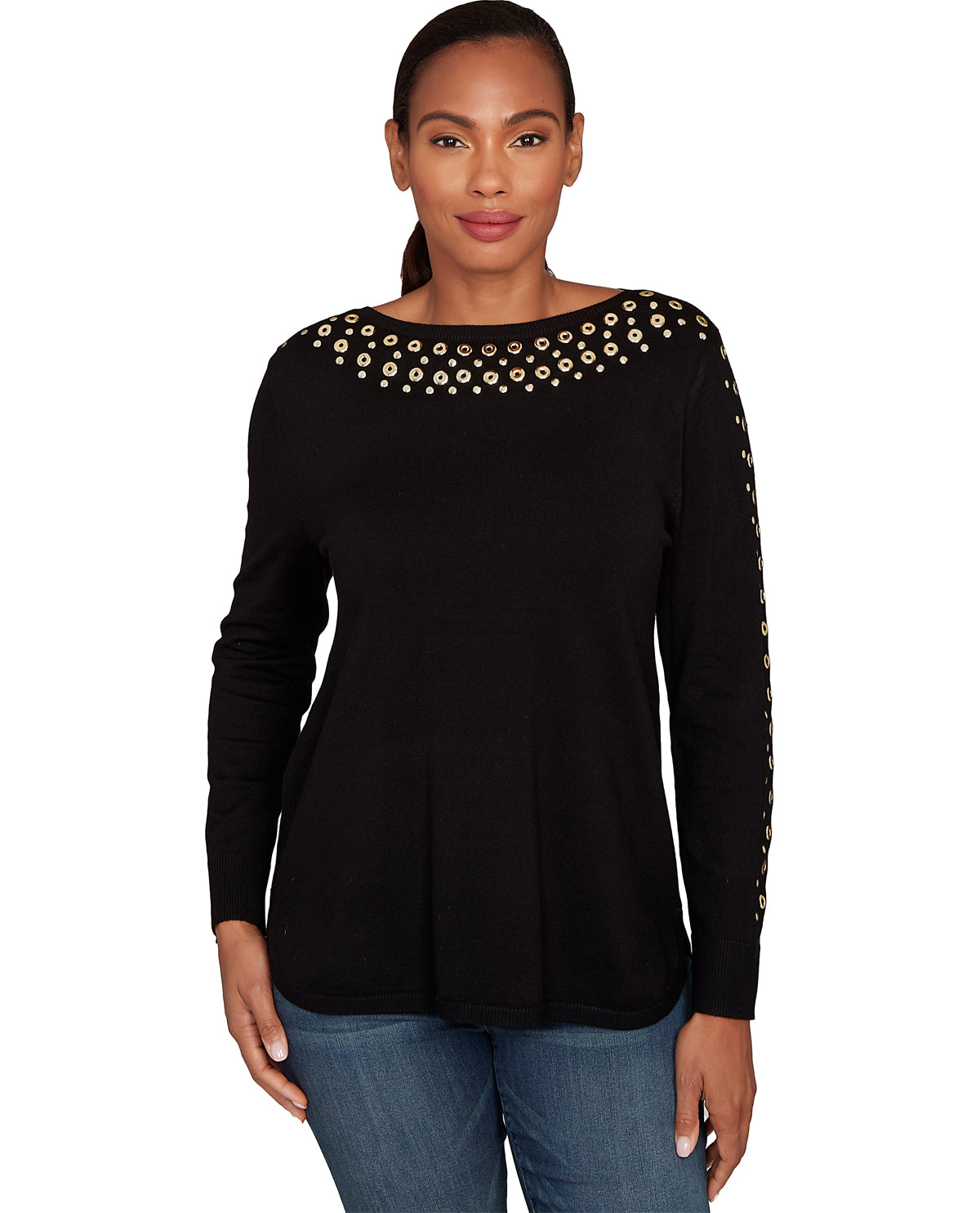 Woman wearing a black long-sleeve top with gold embellishments on a white background