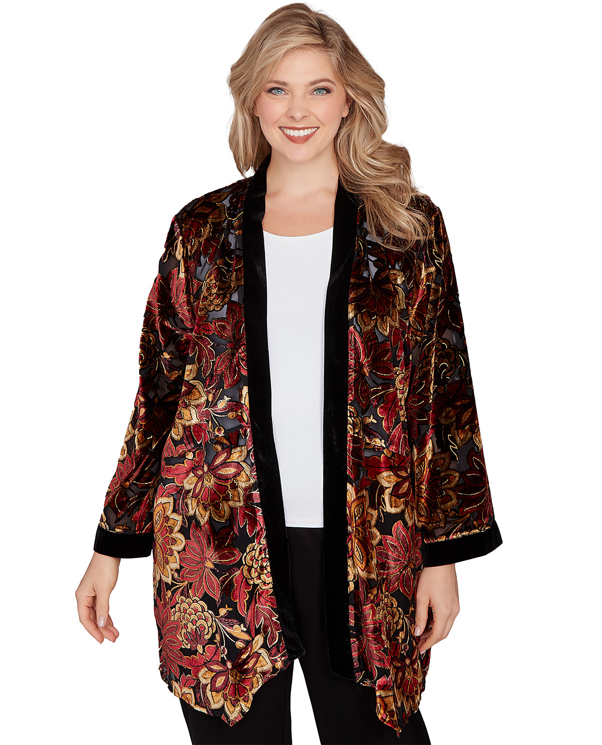 Woman wearing a floral patterned jacket on a white background