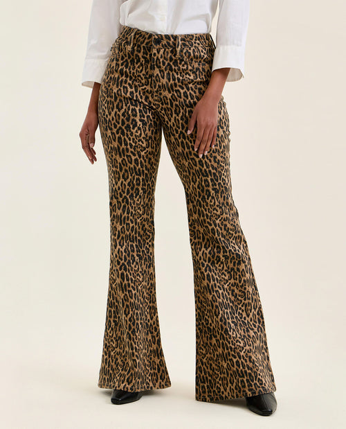 Leopard print pants worn by a person on a white background