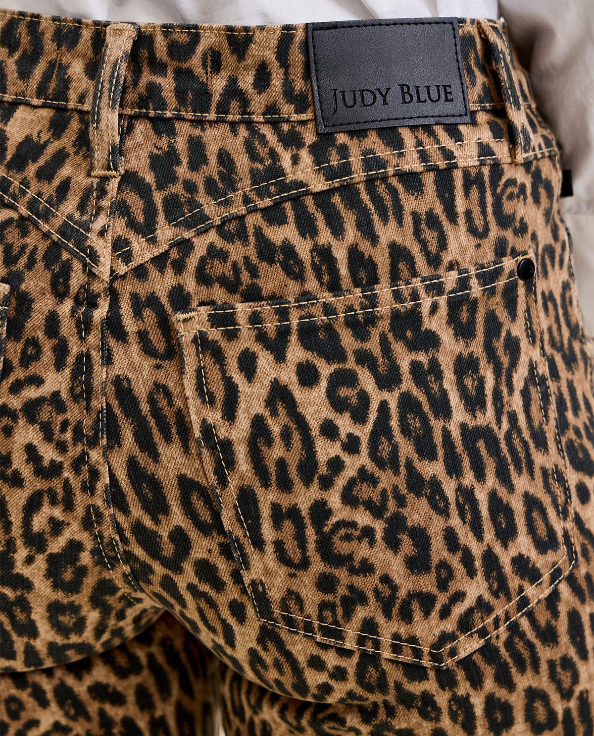Leopard print pants with a Judy Blue label on the waistband.