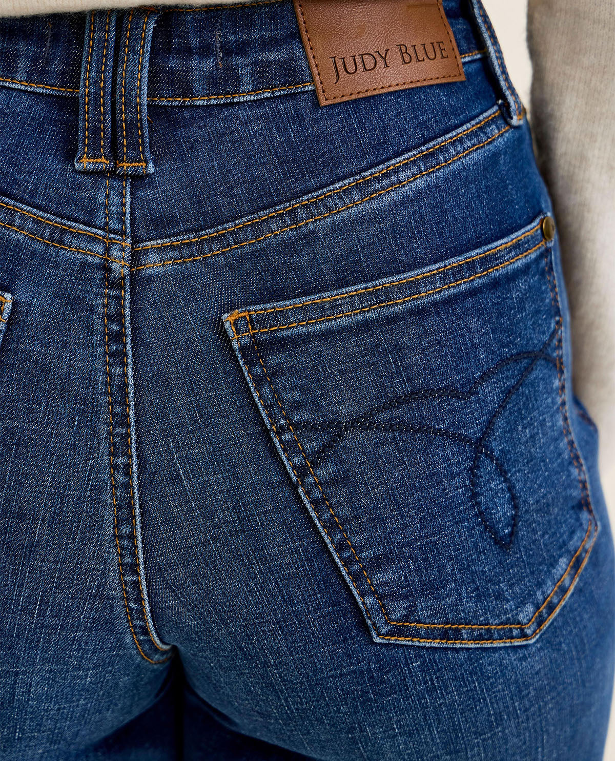 Close-up of blue jeans with a Judy Blue label on the pocket.