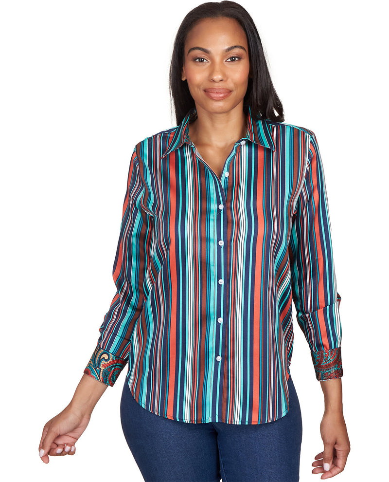 Woman wearing a colorful striped shirt on a white background