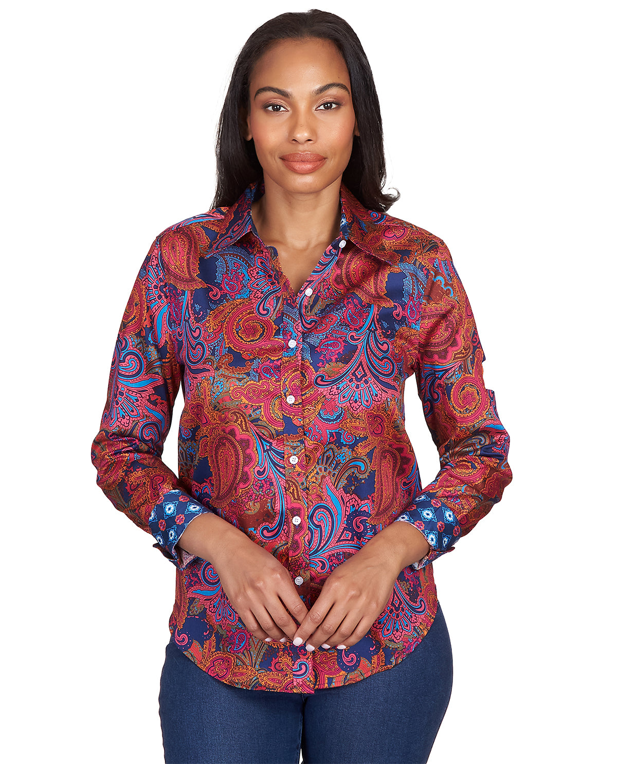 Woman wearing a colorful paisley patterned shirt on a white background