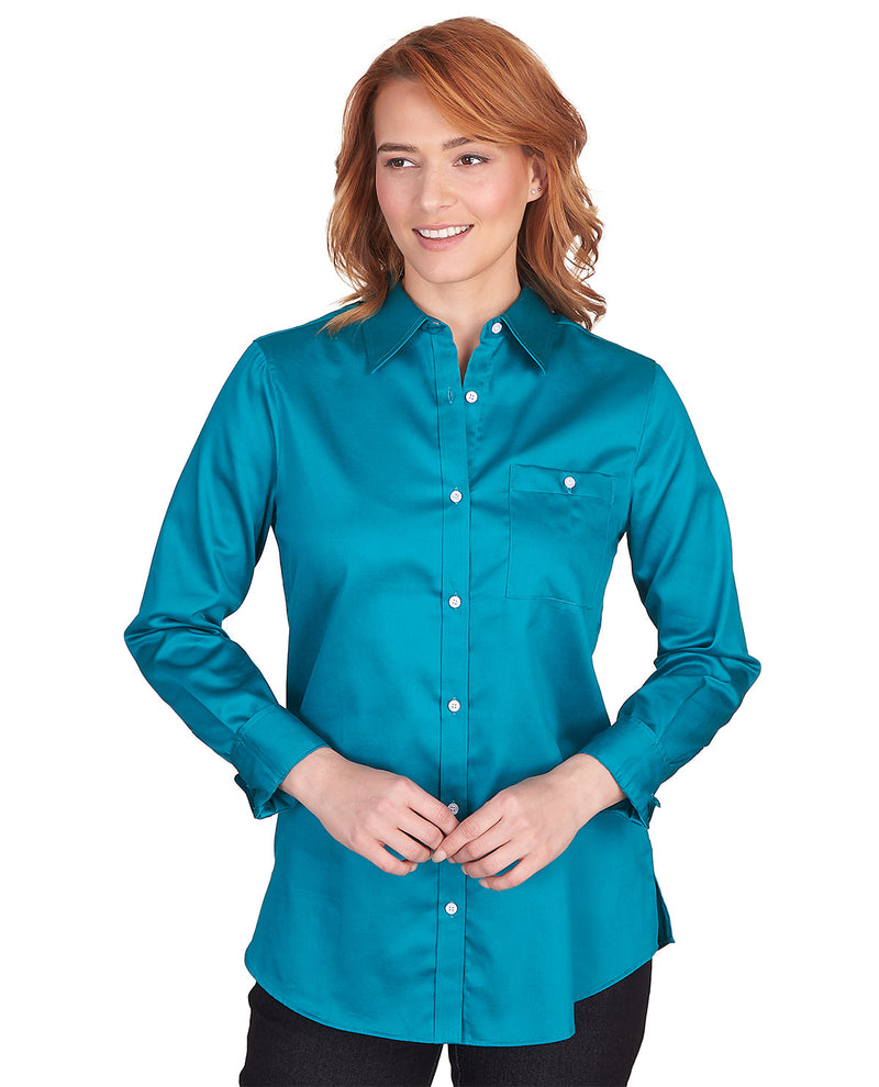 Woman wearing a teal button-up shirt on a white background