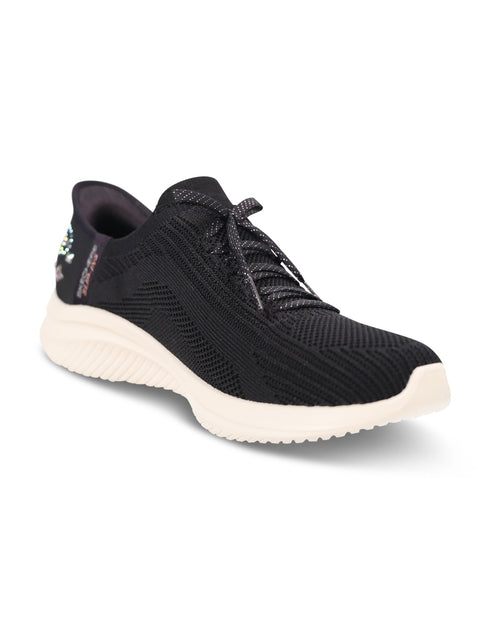 A black knit athletic sneaker with a thick, textured off-white sole, shown from a three-quarters angle on a white background.