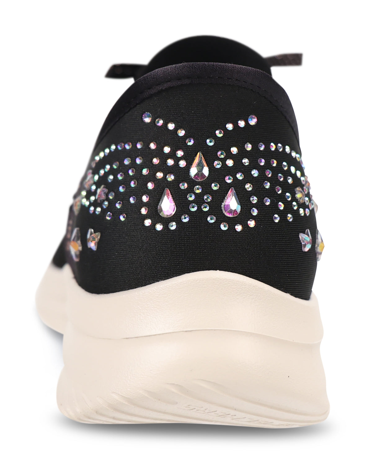 A close-up rear view of a black sneaker featuring decorative iridescent rhinestones arranged in a butterfly pattern on the heel, with a thick cream-colored sole.
