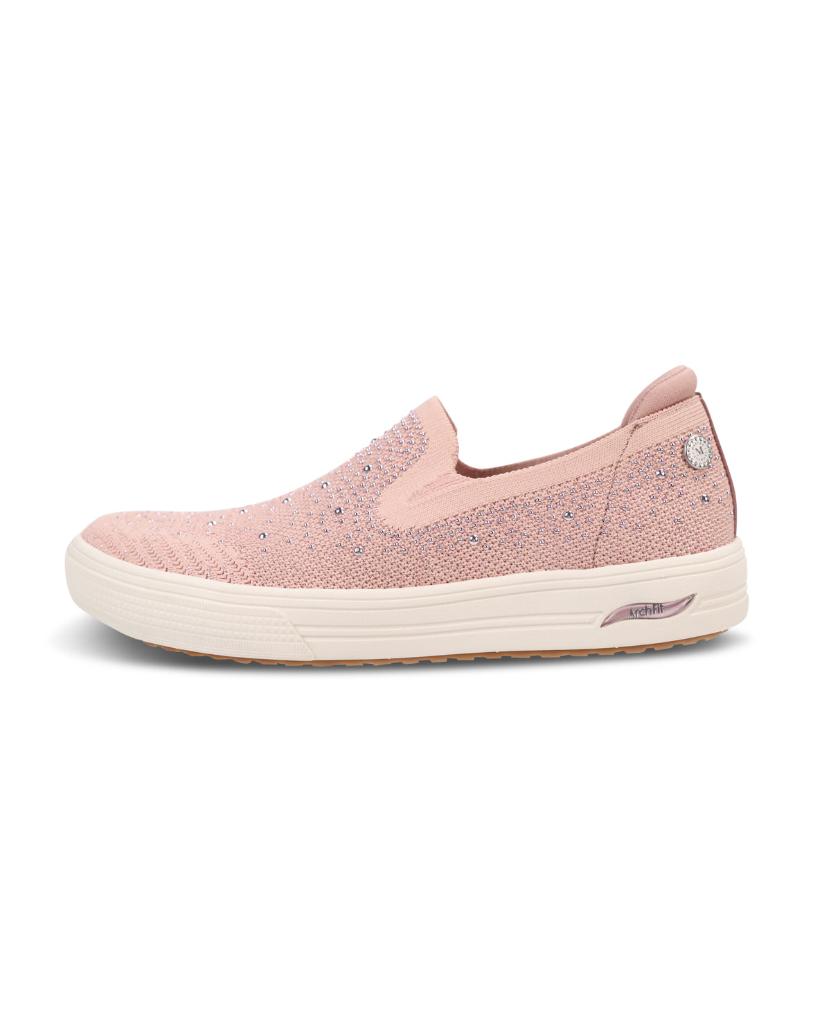 A single slip-on sneaker in light pink with a textured knit upper, a small rhinestone detail on the side, and a thick white platform sole, shown against a plain white background.