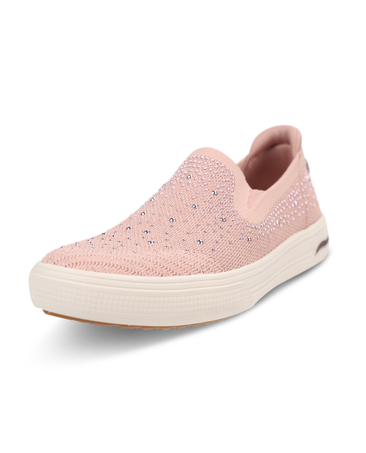 A light pink slip-on sneaker with a textured knit upper covered in small rhinestones, featuring a thick cream-colored platform sole.