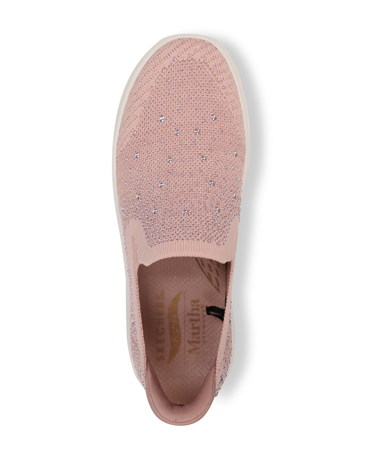 A single slip-on sneaker in light pink with a textured knit upper, a small rhinestone detail on the side, and a thick white platform sole, shown against a plain white background.