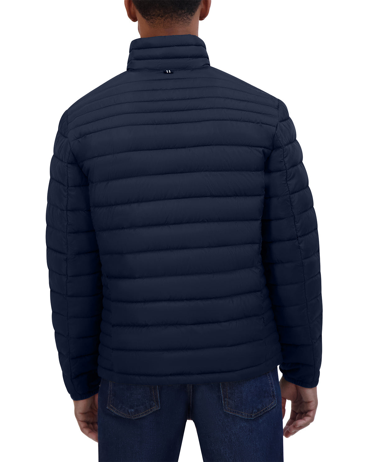 Navy puffer jacket worn by a person on a white background
