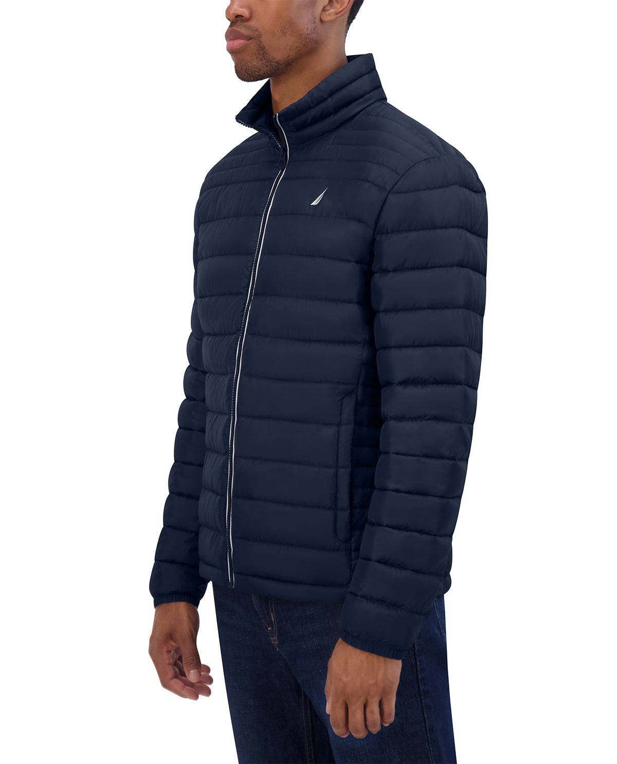 Man wearing a navy puffer jacket on a white background