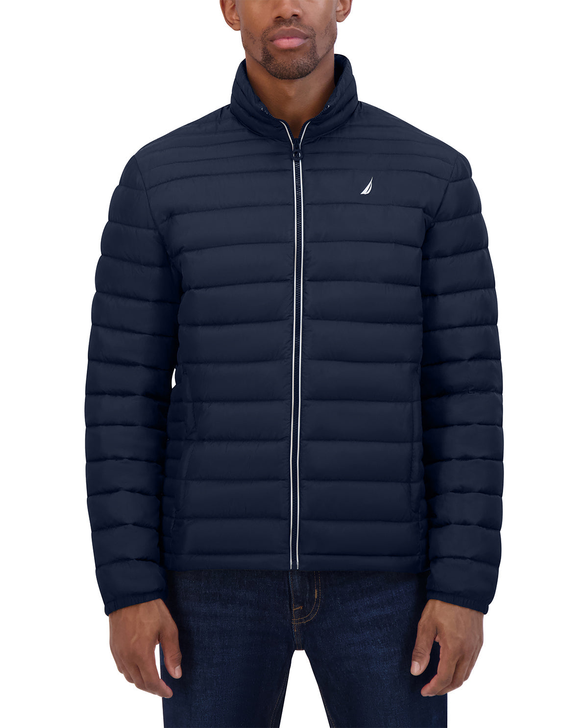 Man wearing a navy puffer jacket with a brand logo on a white background