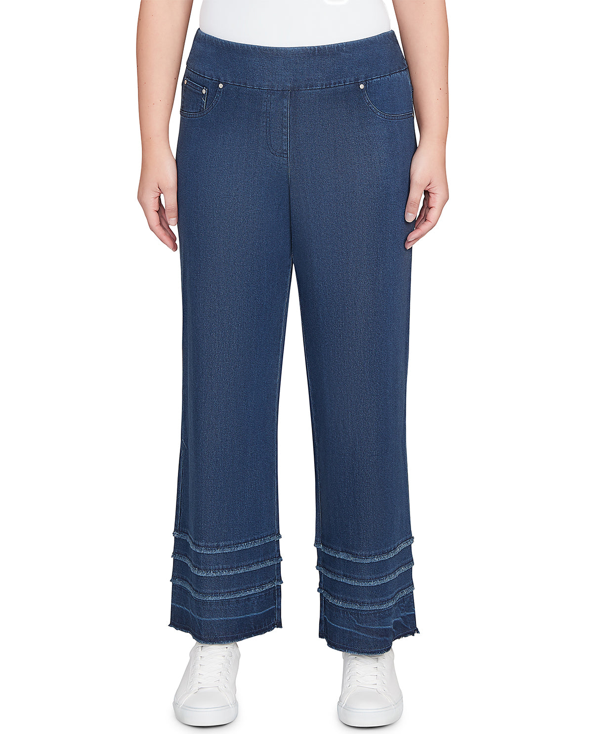 Person wearing blue wide-leg jeans on a white background