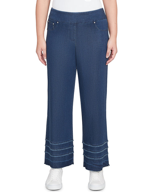 Person wearing blue wide-leg jeans on a white background