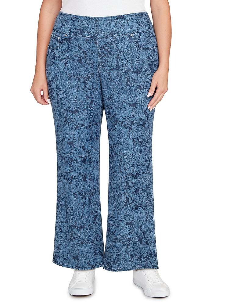 Blue patterned pants worn by a person on a white background