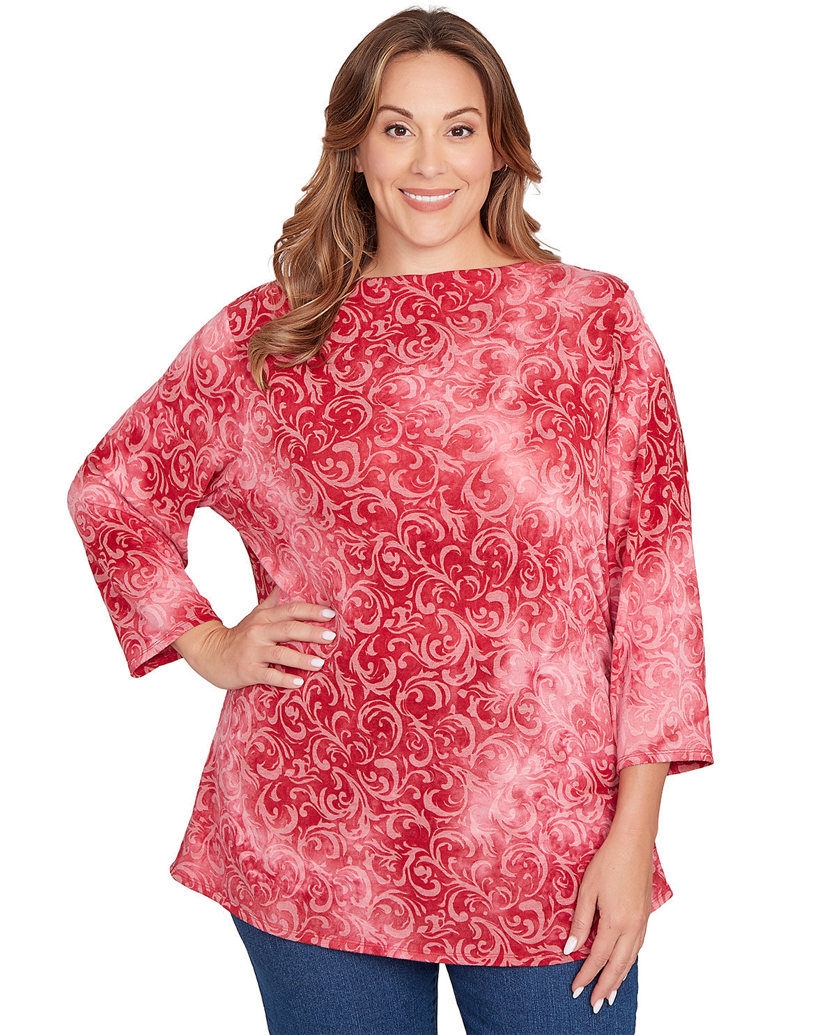 Woman wearing a red patterned blouse on a white background