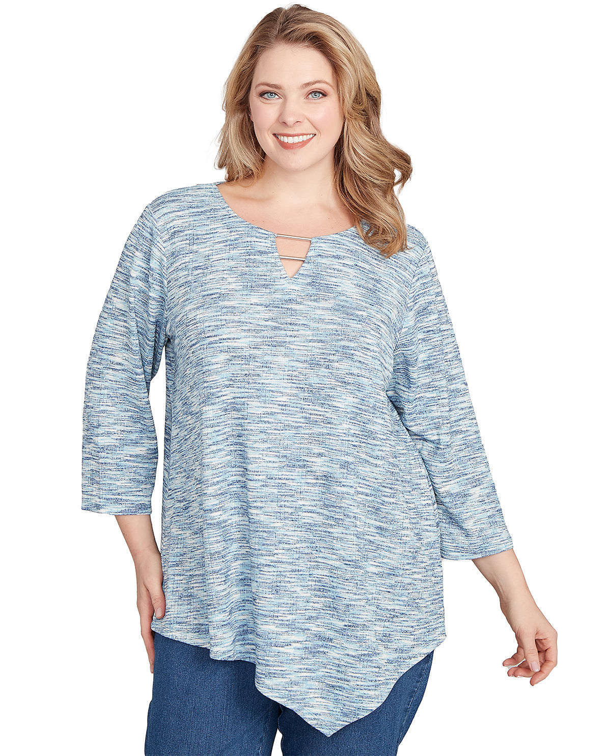 Woman wearing a blue and white patterned top on a white background