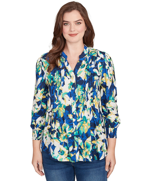 Woman wearing a floral blouse with a white background
