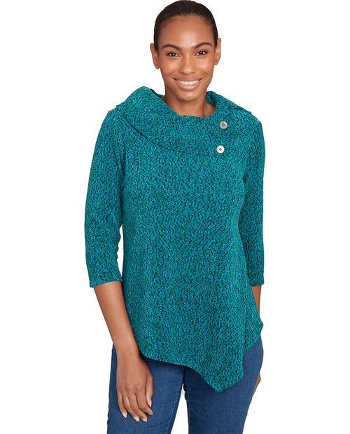 Woman wearing a teal textured sweater with buttons on a white background