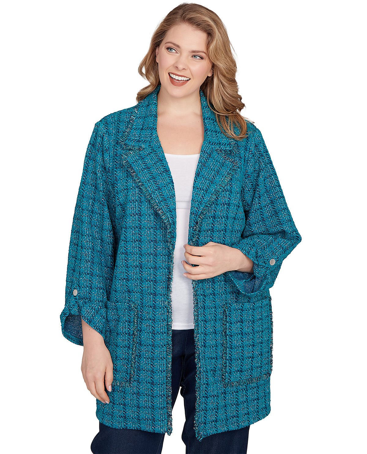 Woman wearing a teal knitted cardigan on a white background