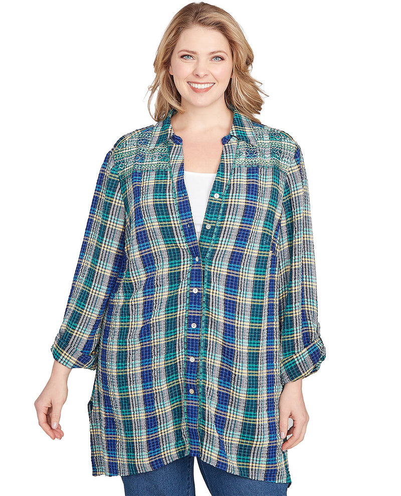 Woman wearing a plaid shirt on a white background