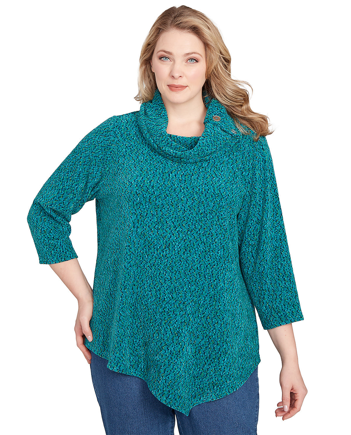 Woman wearing a teal knitted poncho on a white background