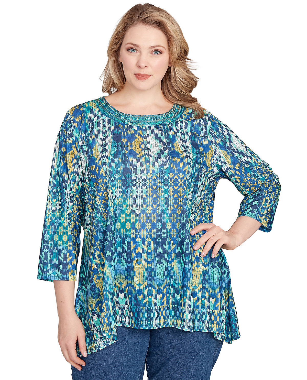 Woman wearing a blue patterned blouse on a white background