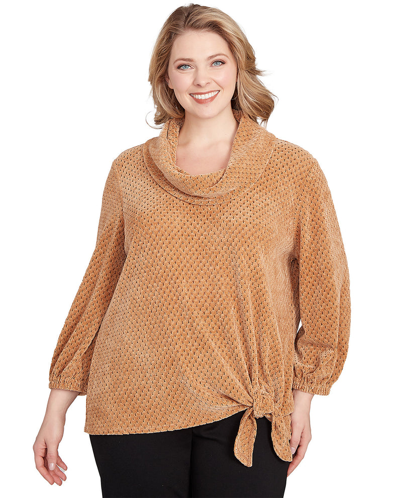 Woman wearing a brown textured sweater on a white background