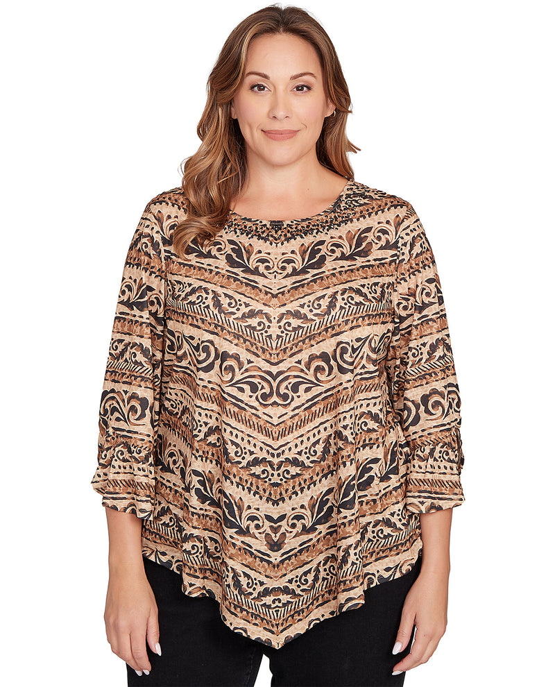 Woman wearing a patterned blouse on a white background