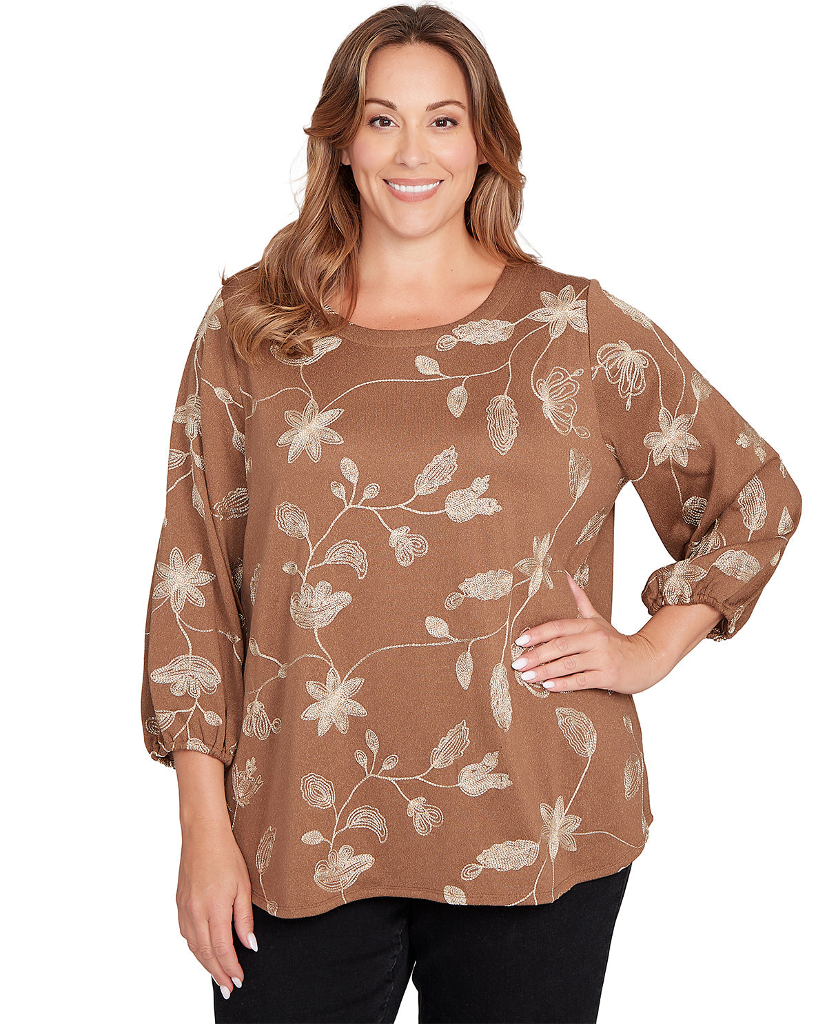 Woman wearing a brown floral blouse on a white background