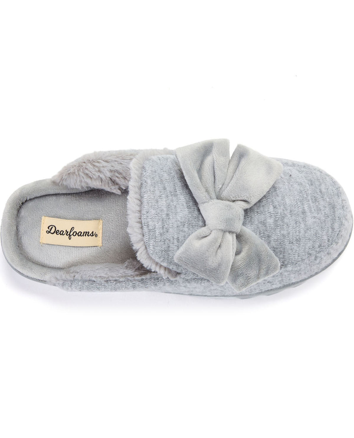 A light gray plush slipper with a large matching bow on the toe, shown from a top-down view on a white background. The brand label 'Dearfoams' is visible on the inner sole.