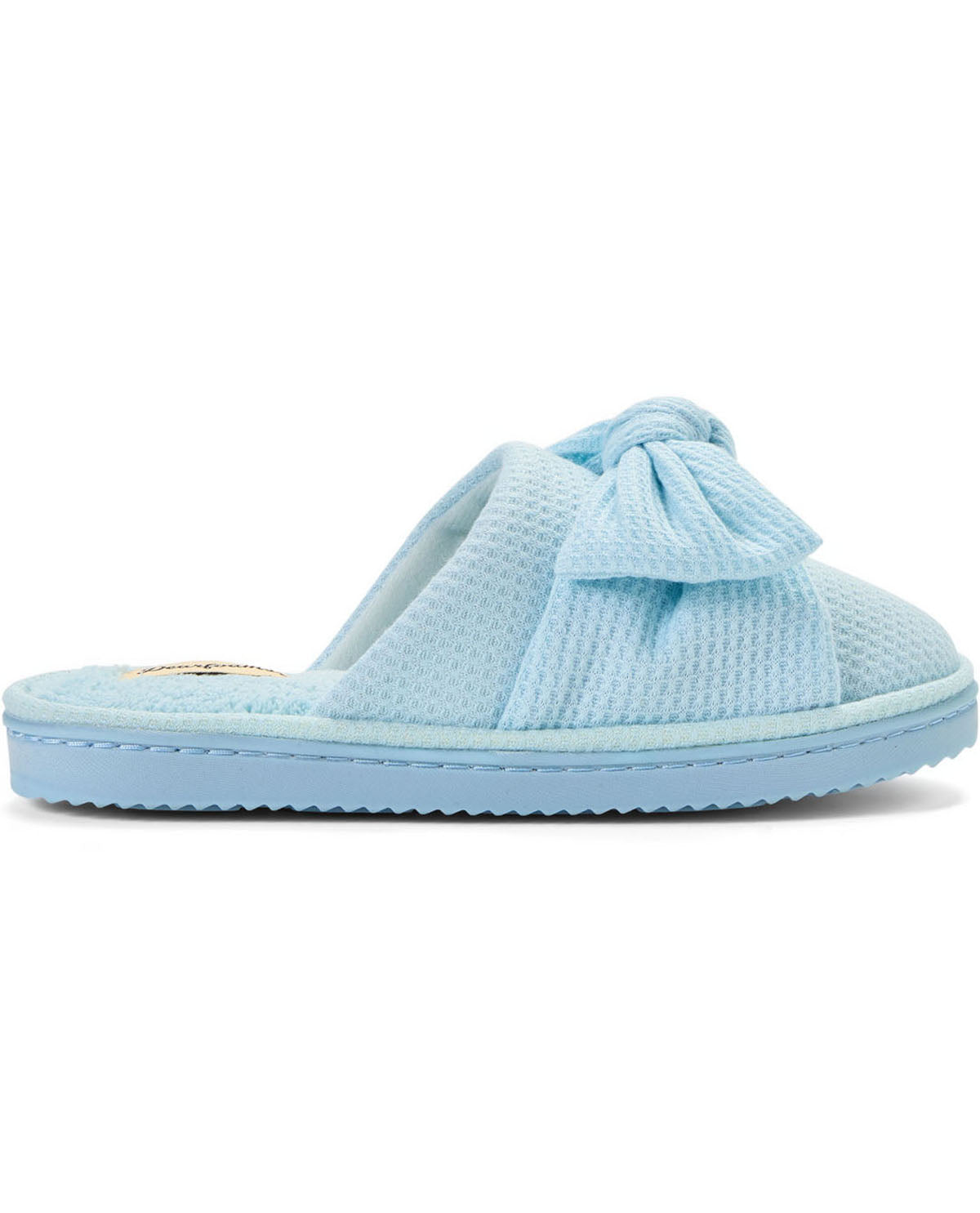 A light blue waffle-knit slip-on sandal with a large bow detail across the top strap and a matching blue sole, shown against a plain white background.