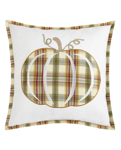 A square white throw pillow featuring a central embroidered pumpkin design with a green, beige, and brown plaid pattern, a tan stem, and a matching plaid border.