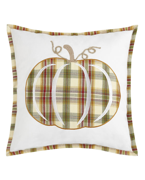 A square white throw pillow featuring a central embroidered pumpkin design with a green, beige, and brown plaid pattern, a tan stem, and a matching plaid border.
