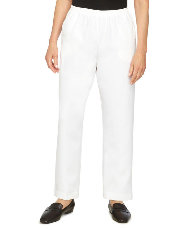 White pants worn by a person on a white background