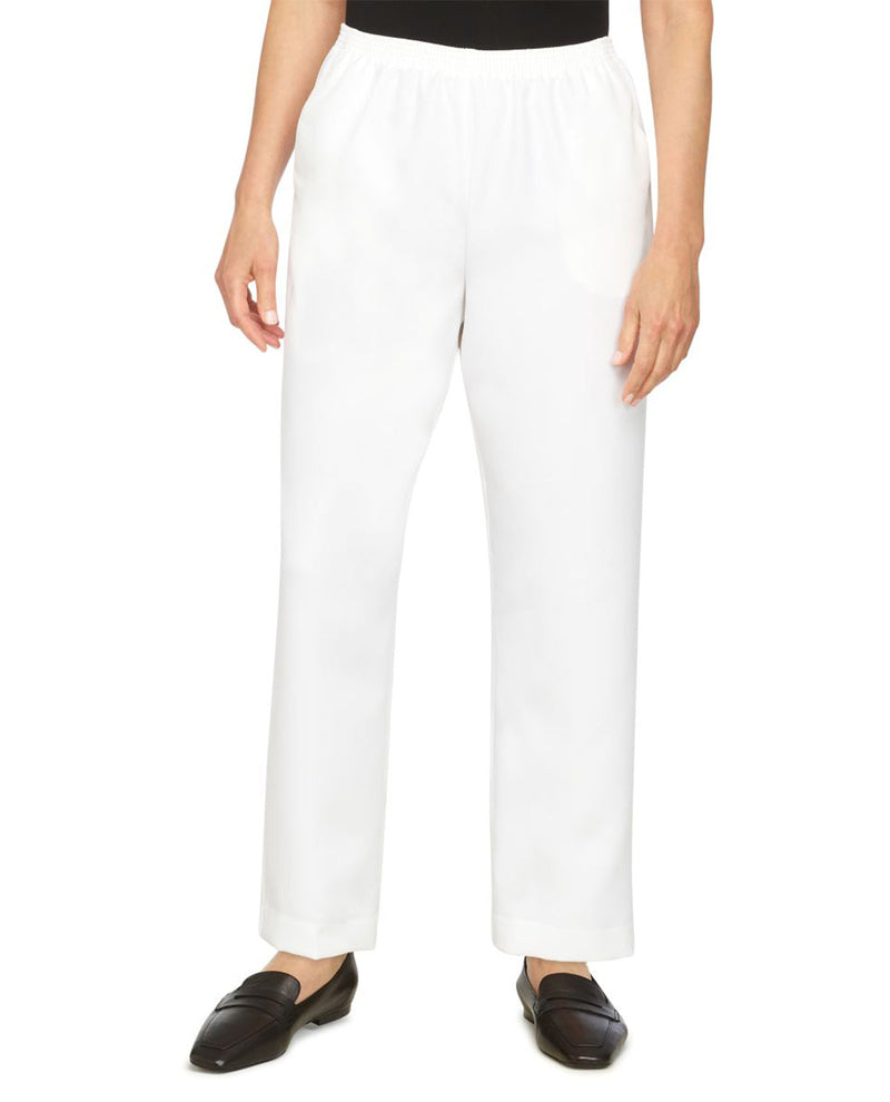 White pants worn by a person on a white background