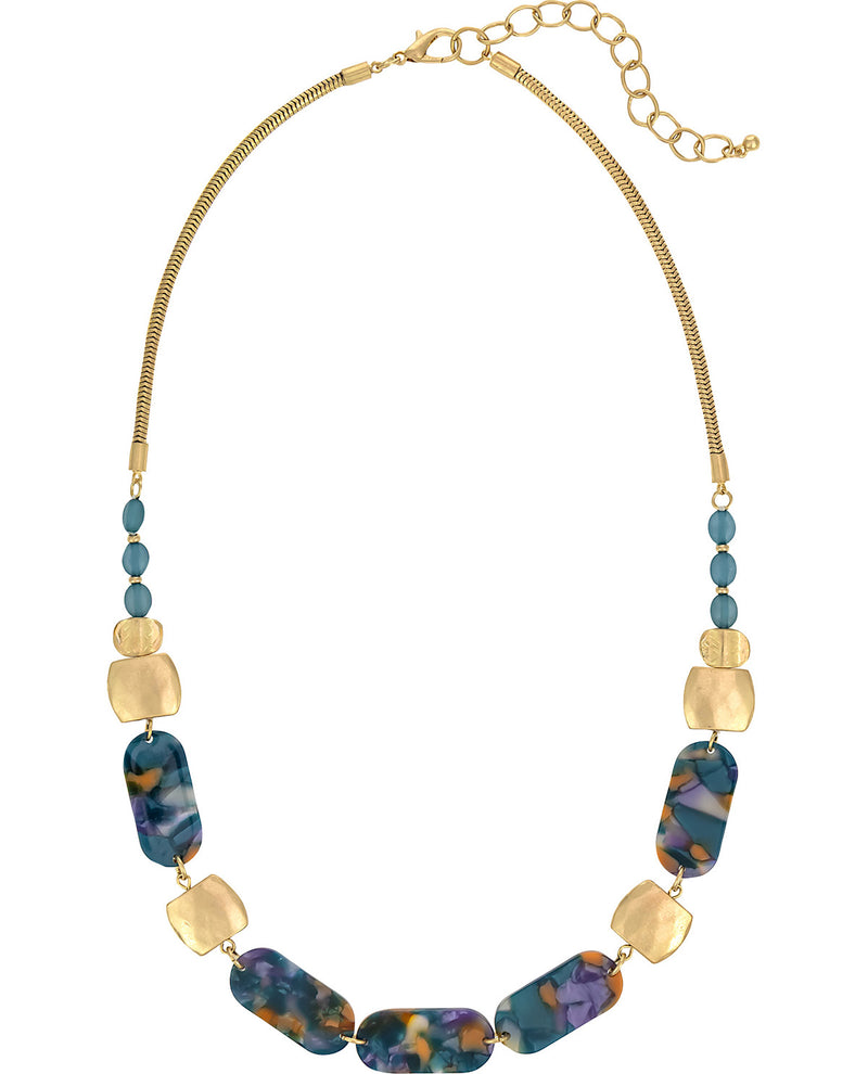 A gold-tone chain necklace featuring a series of marbled blue, purple, and orange glass beads accented by flat gold-tone discs and small blue beads, shown on a plain white background.
