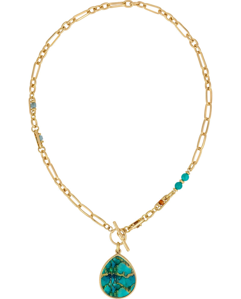 A gold-toned chain necklace with a large teardrop-shaped turquoise stone pendant, accented with small turquoise beads and a toggle clasp, shown on a plain white background.