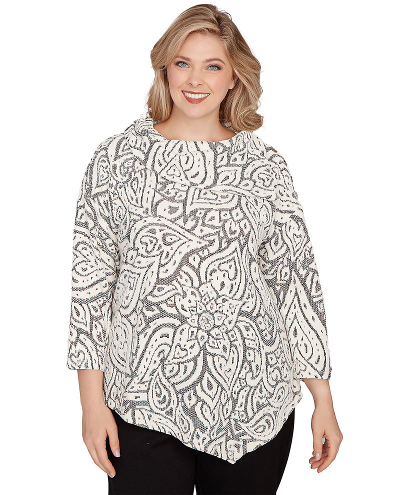 Woman wearing a white patterned blouse on a white background