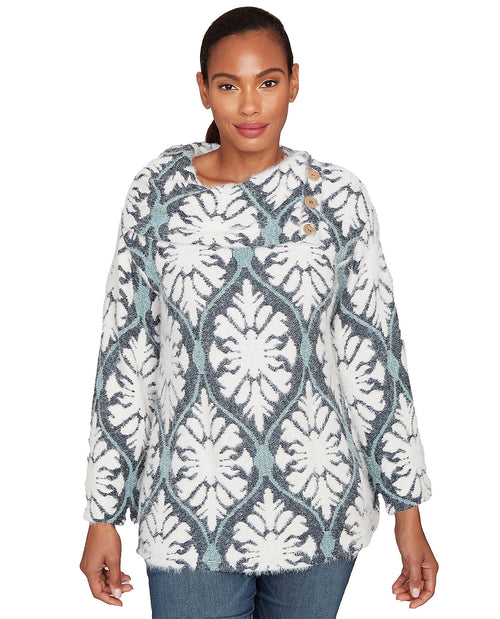 Woman wearing a patterned sweater on a white background