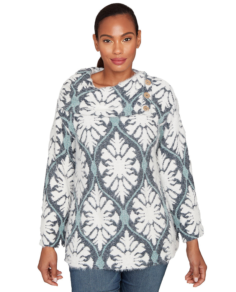 Woman wearing a patterned sweater on a white background