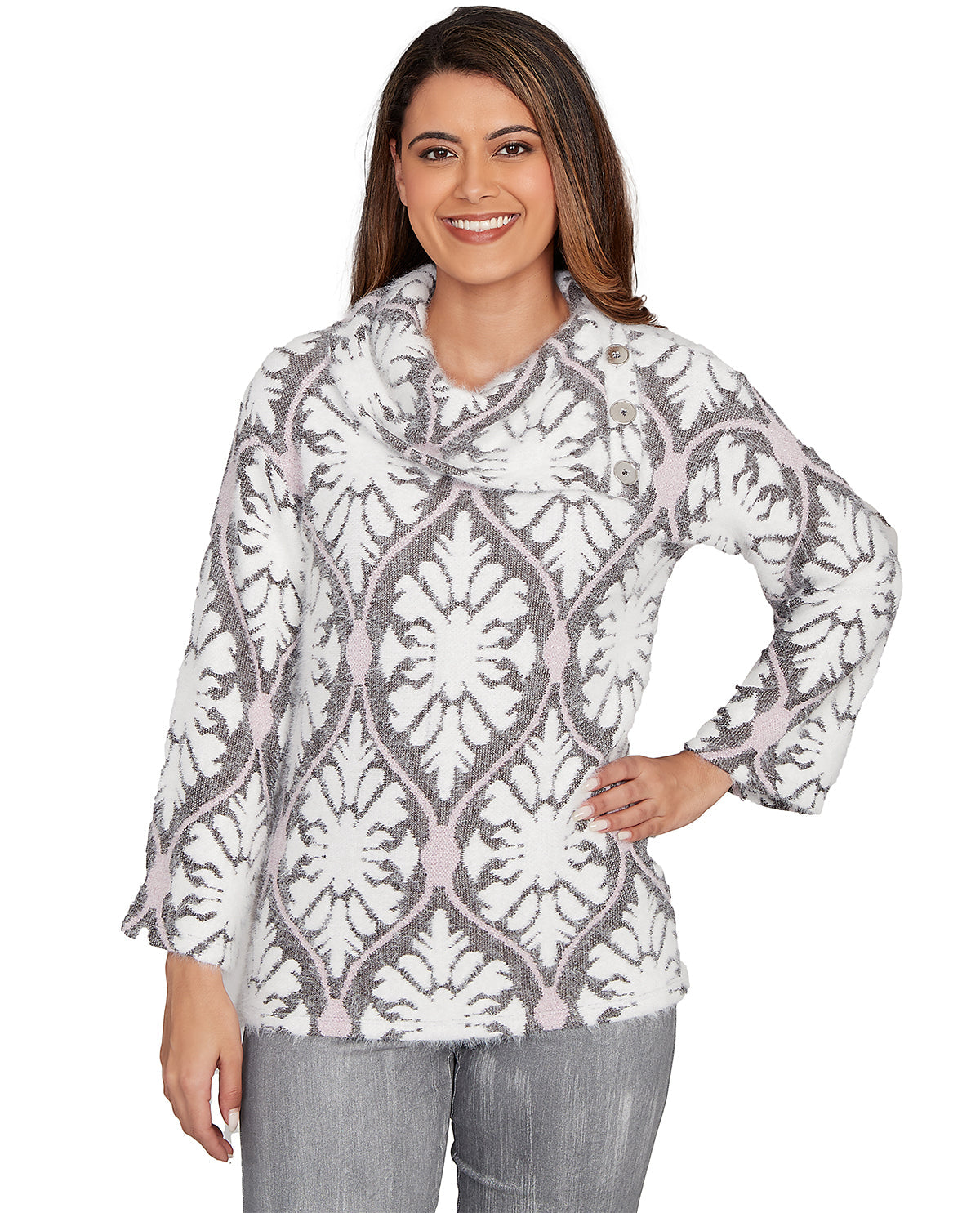 Woman wearing a patterned long-sleeve top on a white background