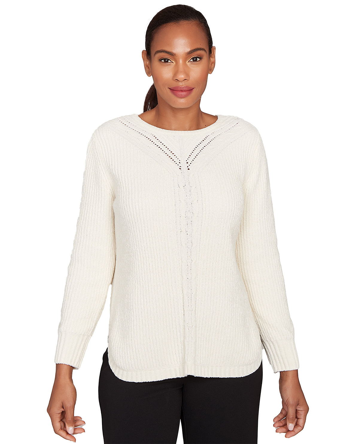 Woman wearing a cream-colored sweater with a subtle pattern on a white background
